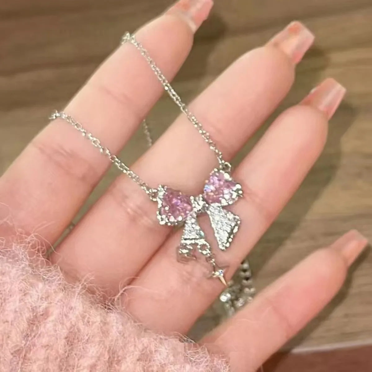 Elegant pink bow necklace with star pendant for occasions