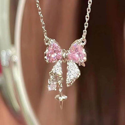 Elegant pink bow necklace with star pendant for occasions