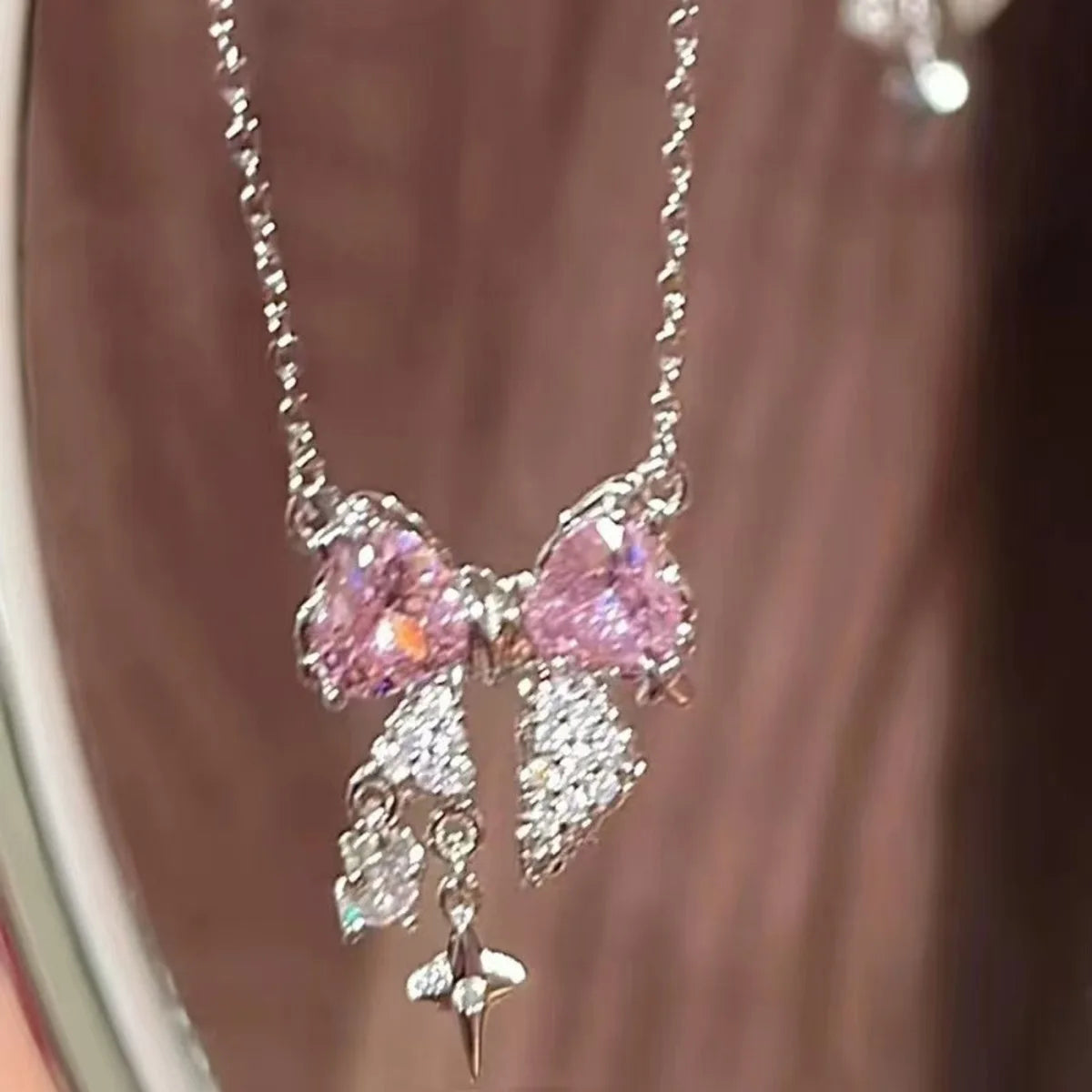 Elegant pink bow necklace with star pendant for occasions