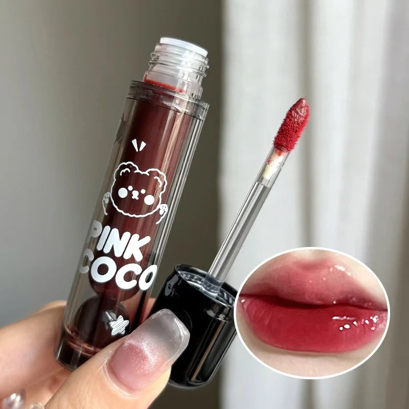 Lip Glaze – shiny nude gloss with cute bear design.